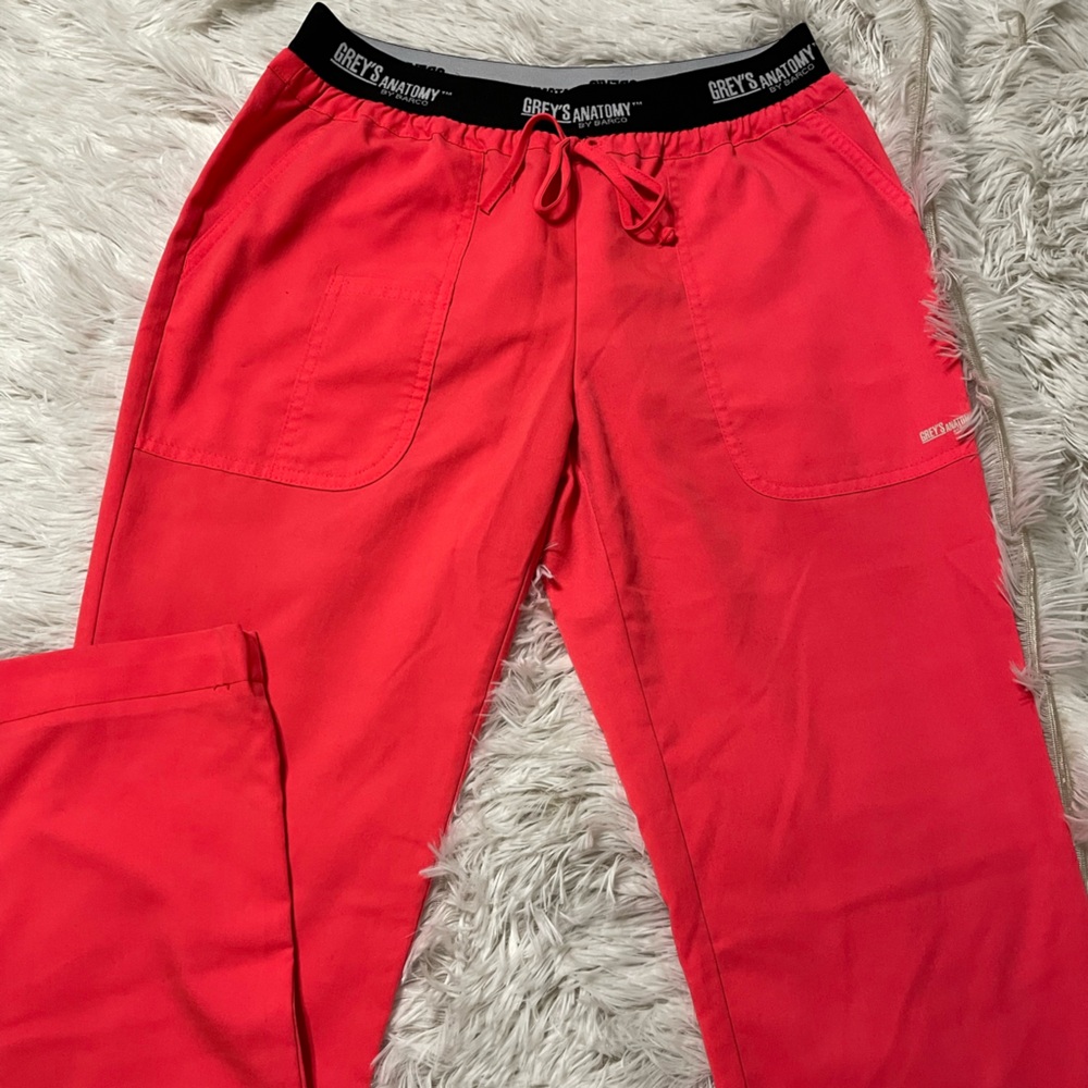 Grey’s Anatomy scrub pants size small regular. The color is coral
